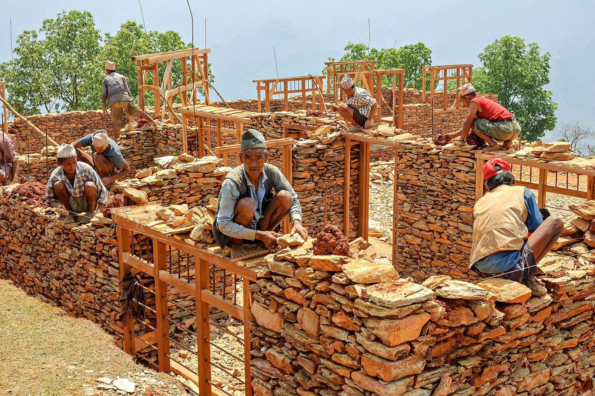 Masons working with natural stone and clay mortar in Dhading, Nepal